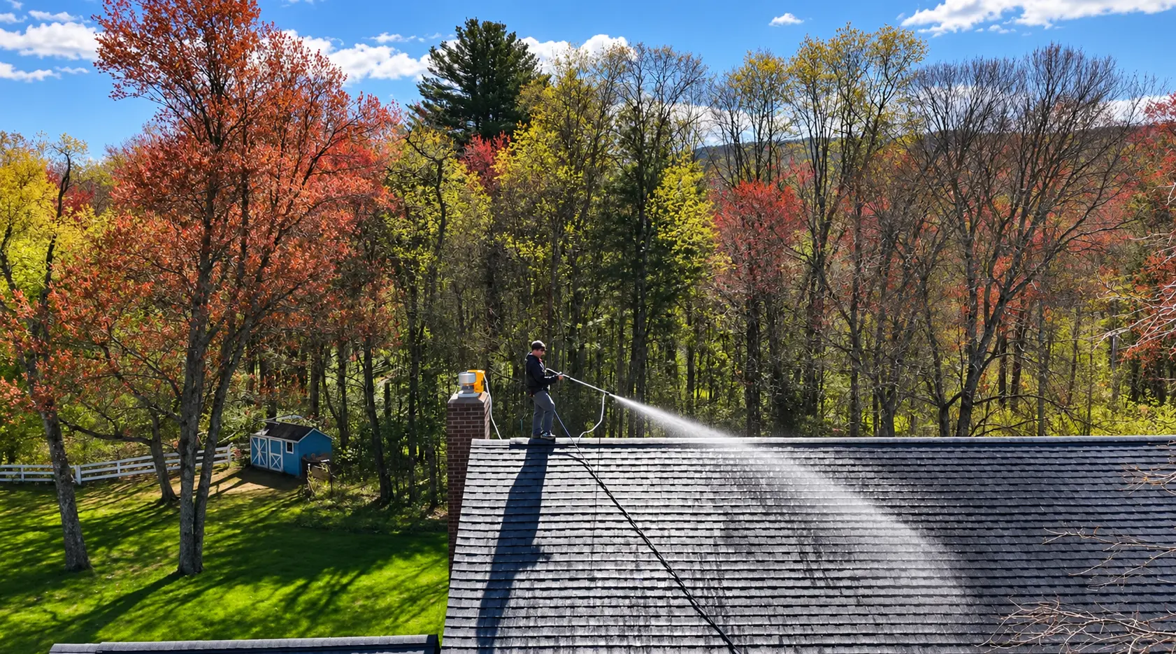 Splash Bros technicians beside their service van outside a Western Massachusetts home